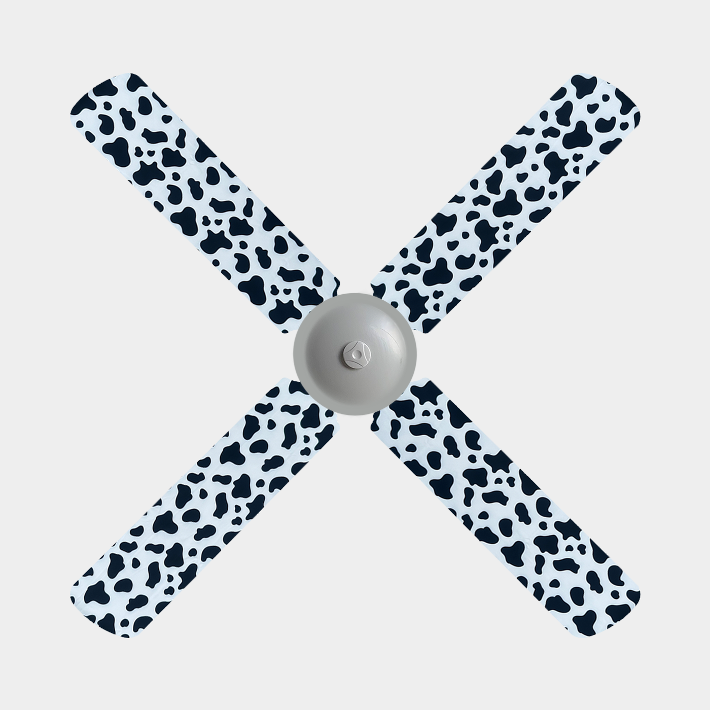 Cow print fabric fan blade covers on a 4 blade ceiling fan