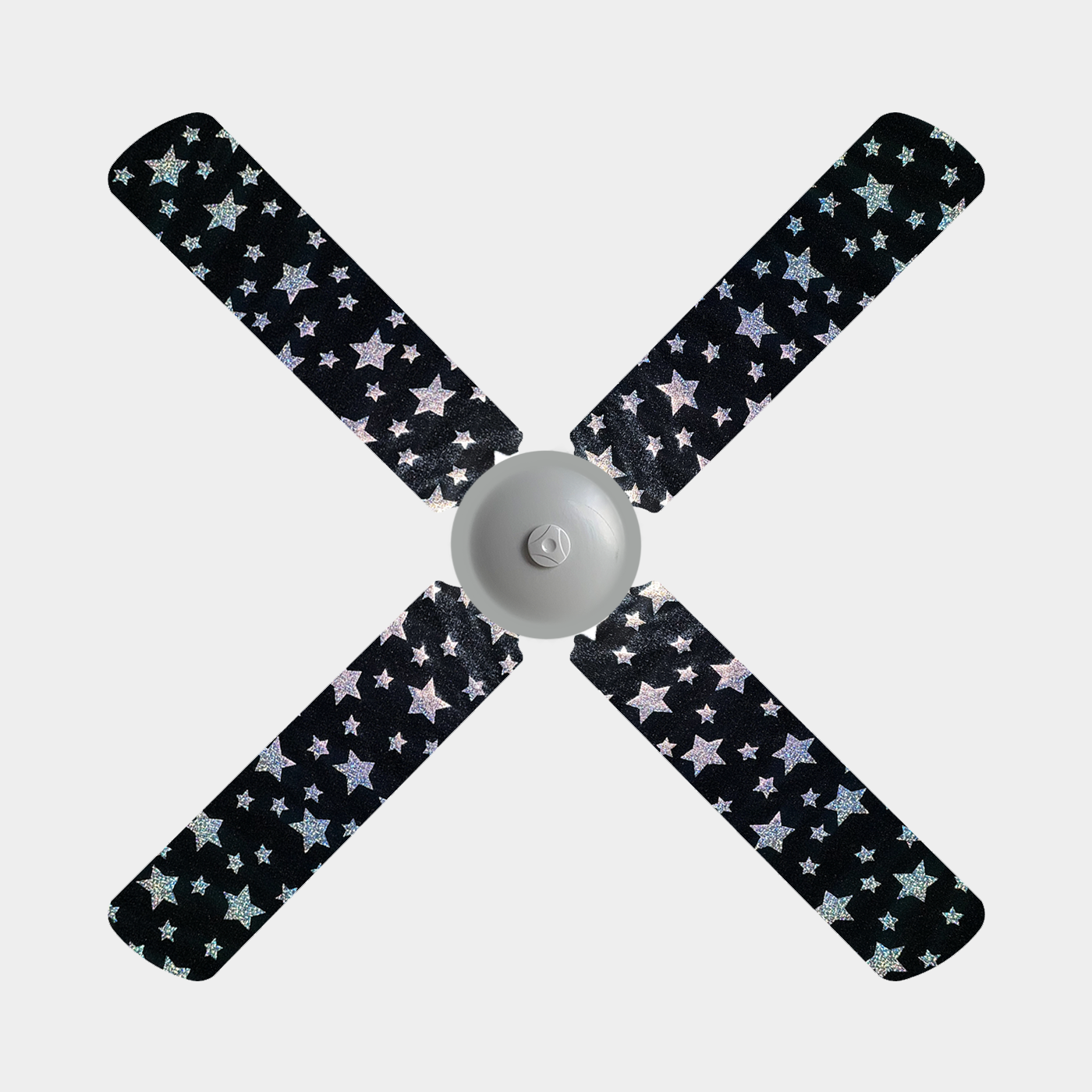 Black ceiling fan blade covers with holographic stars on them on a 4 blade ceiling fan