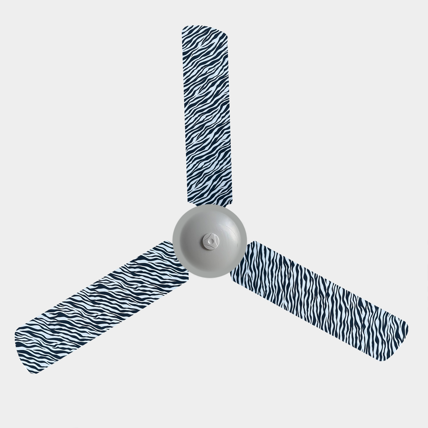 Zebra print fabric fan blade covers on a 3 blade ceiling fan