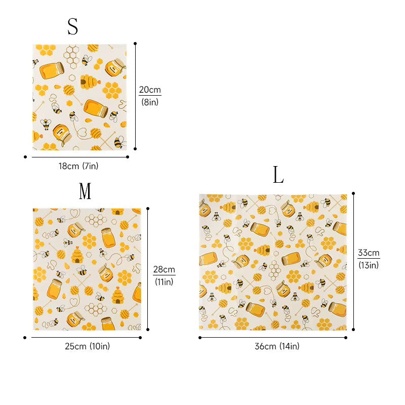Size chart showing three beeswax wrap sizes labeled S, M, and L with a repeating honeybee and honey jar pattern. The chart includes dimensions in centimeters and inches for each size on a white background.