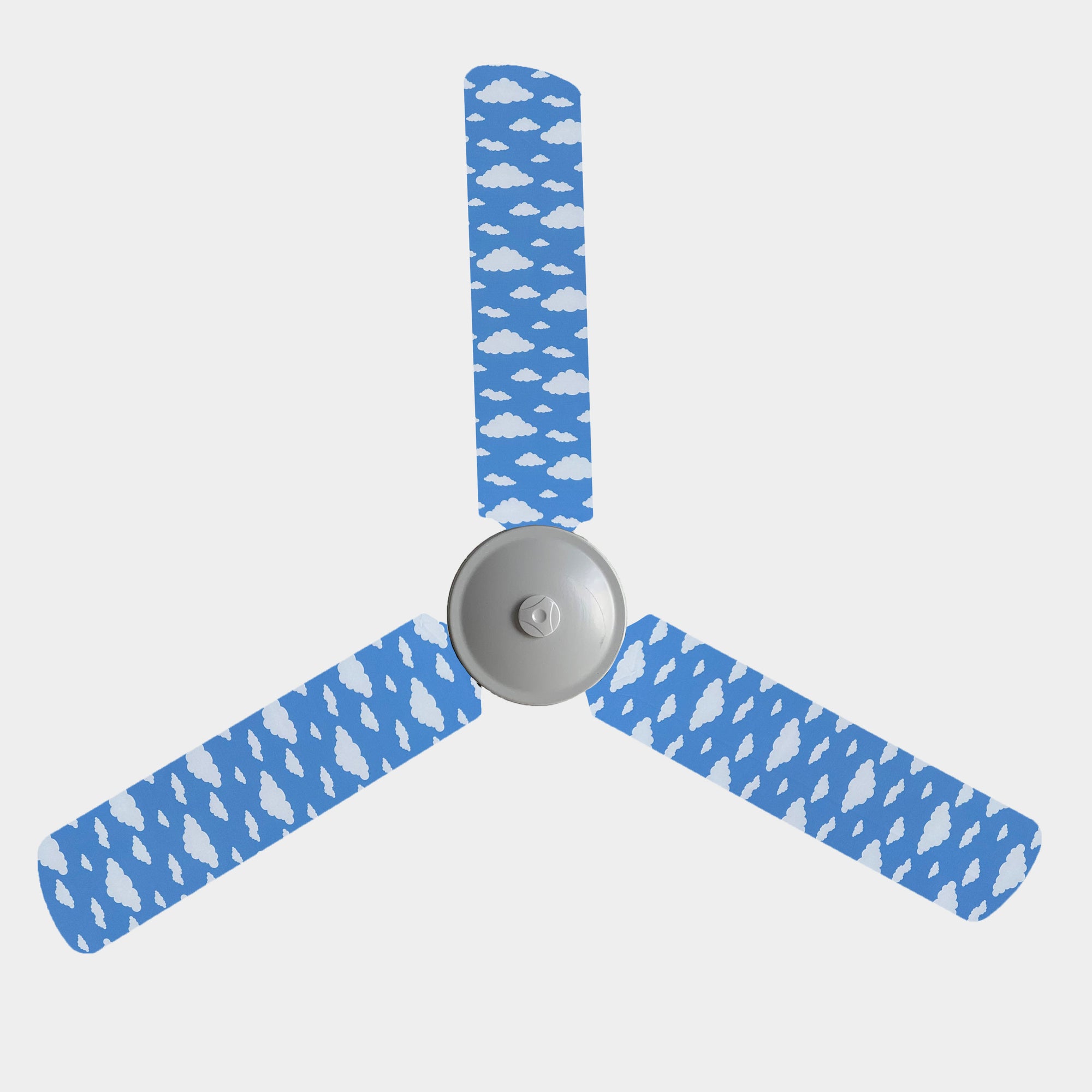 Blue sky background with white fluffy cloud fan blade covers on a 3 blade fan