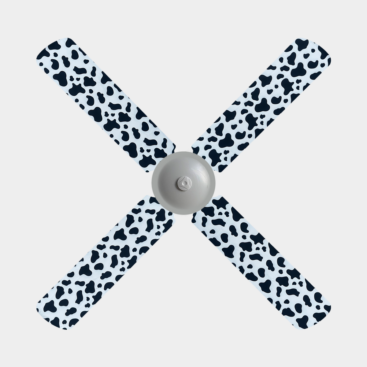Cow print fabric fan blade covers on a 4 blade ceiling fan