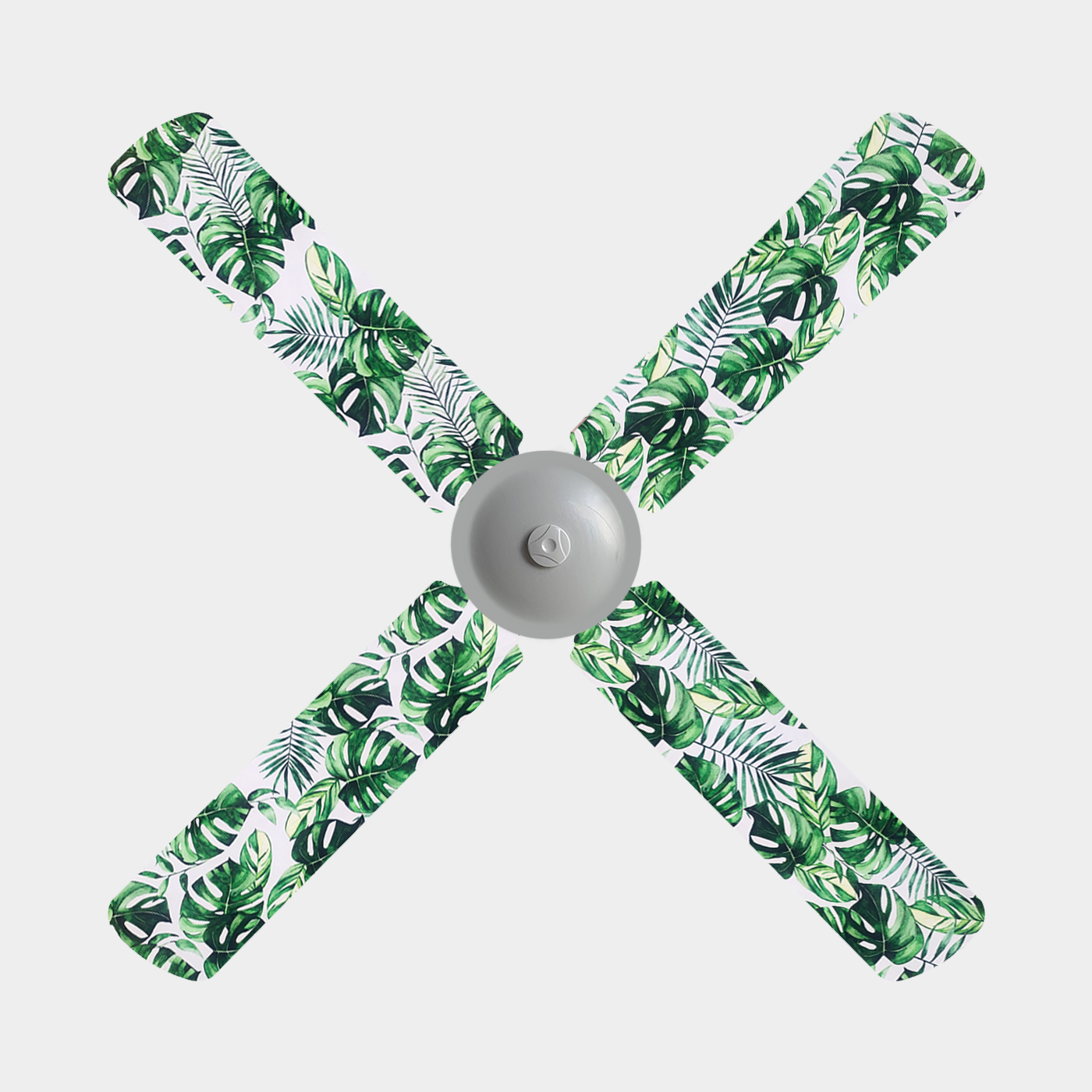Green monstera leaves and green fern print fanblade covers on a white background