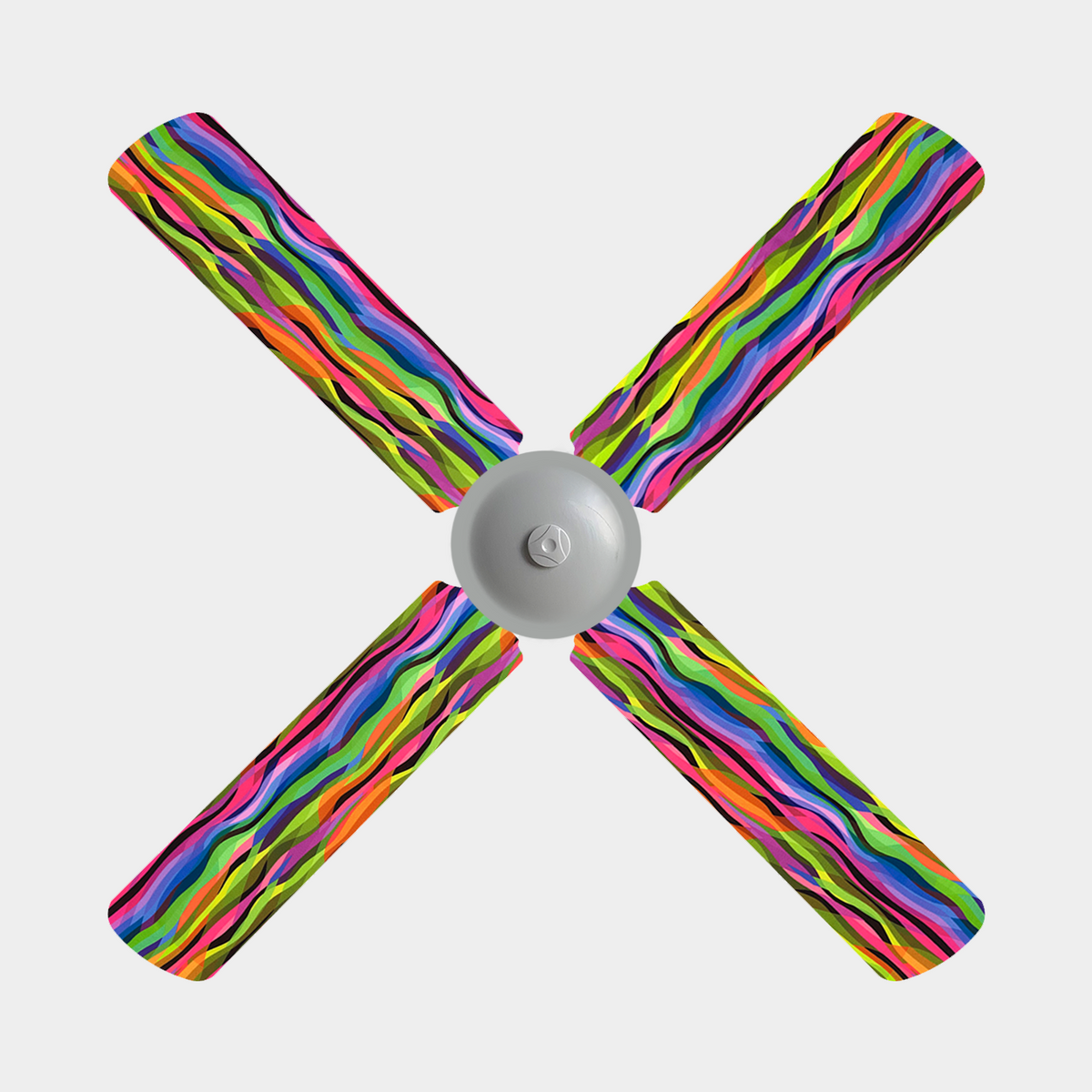 A 4 blade ceiling fan with fabric covers on it which are bright yellow, pink, green, blue and a hint of black wavy stripes
