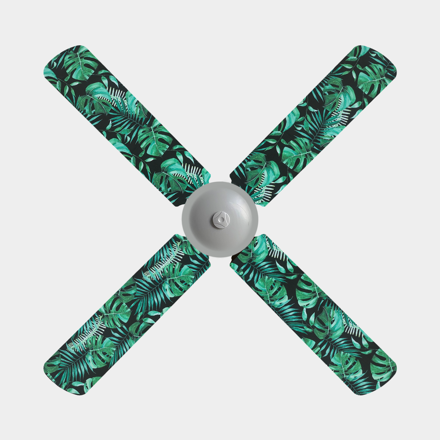 Three blade ceiling fan with fan covers with black background and large green leaves and ferns