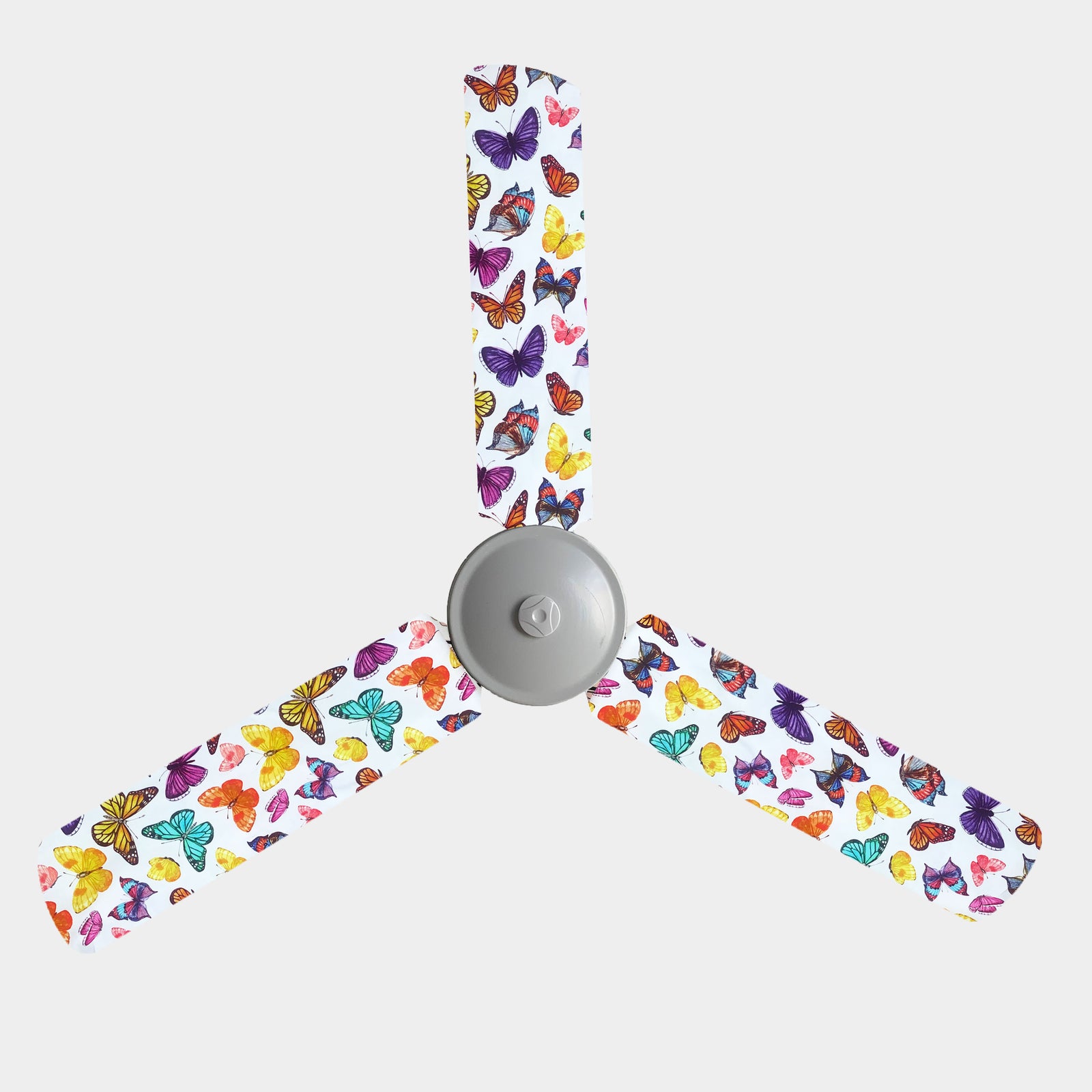 Purple, yellow, red, pink, and blue butterflies on white background fan blade covers