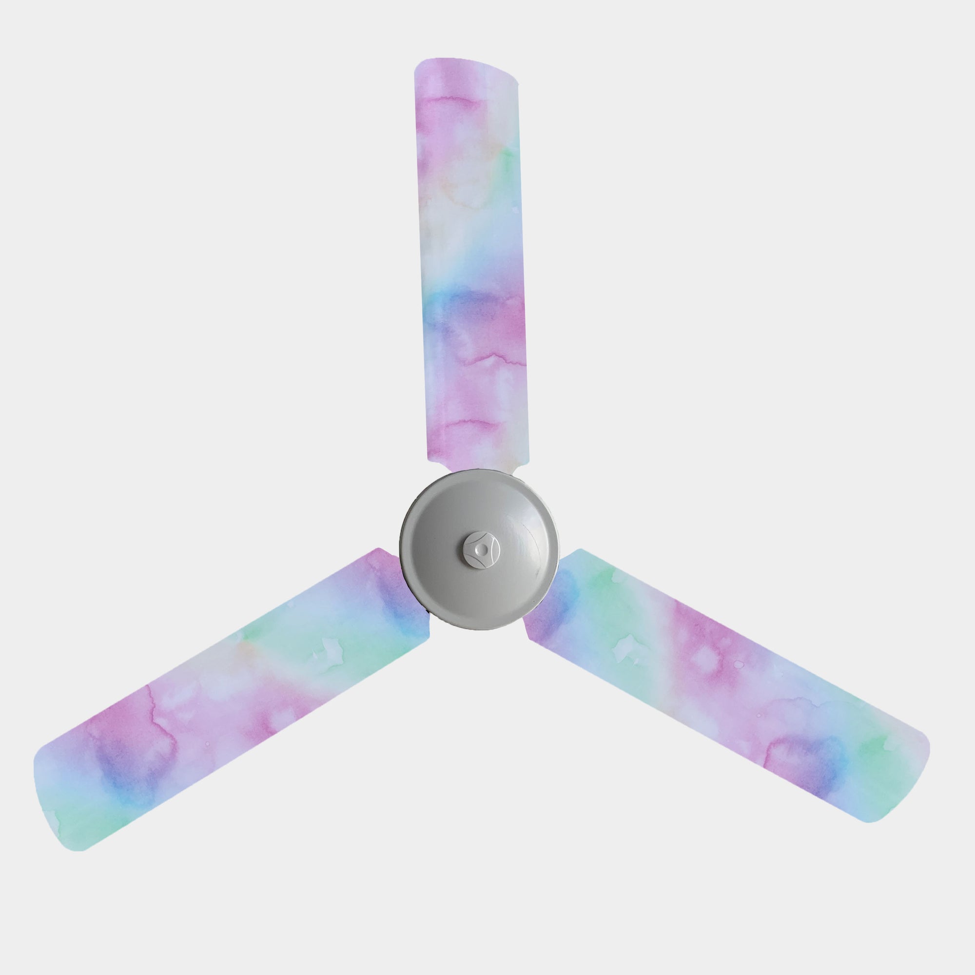 Pastel pink, purple, yellow, and green cloud-like pattern fan covers on three blade ceiling fan.
