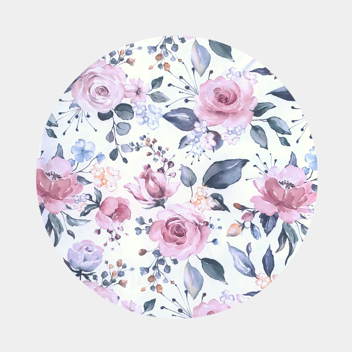 Patterns of  large pink roses and green leaves and on a white background