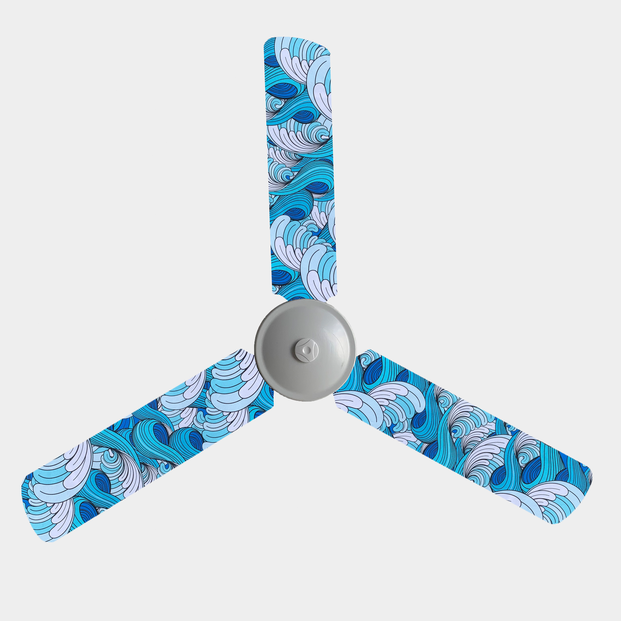 Ceiling fan blde cover with blue and white waves design