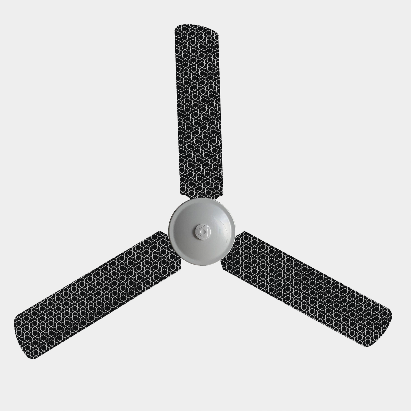 Three blade fan with covers with black background and white geometric pattern