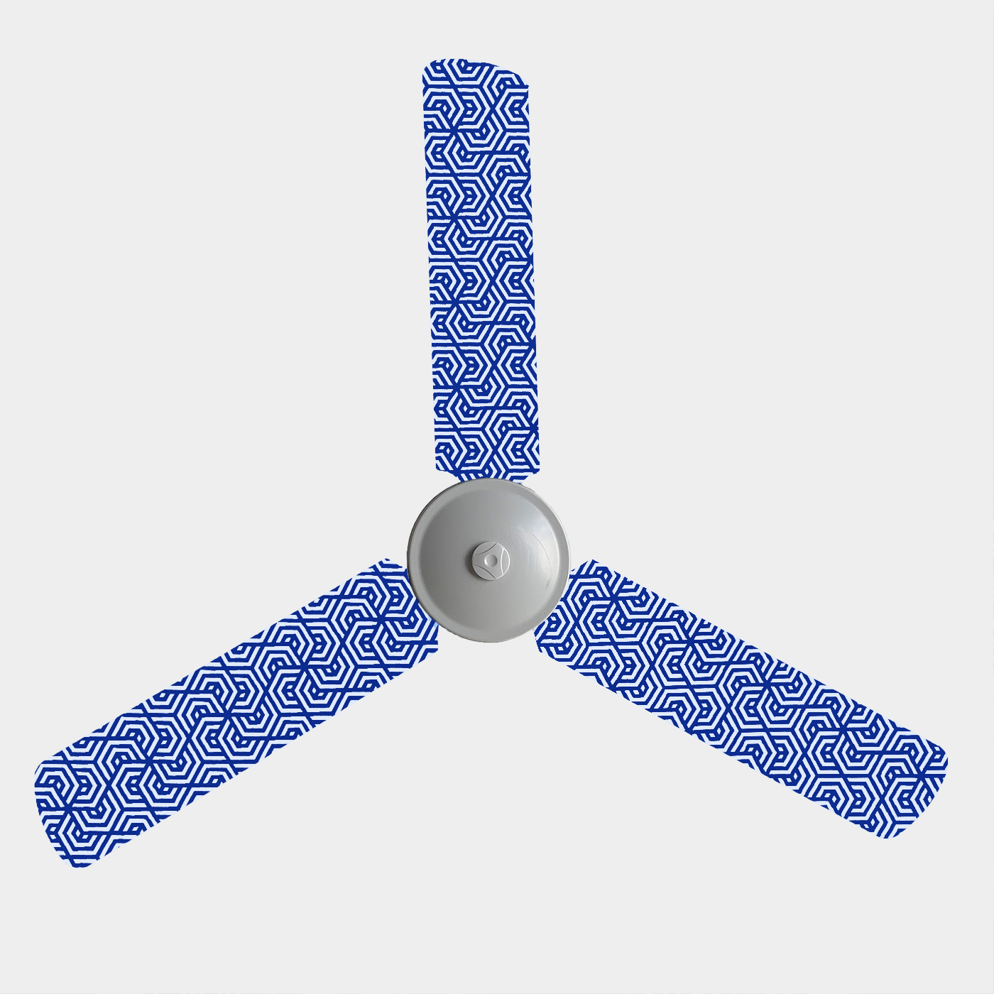 Fabric covers with blue background and white geometric pattern on three blade ceiling fan