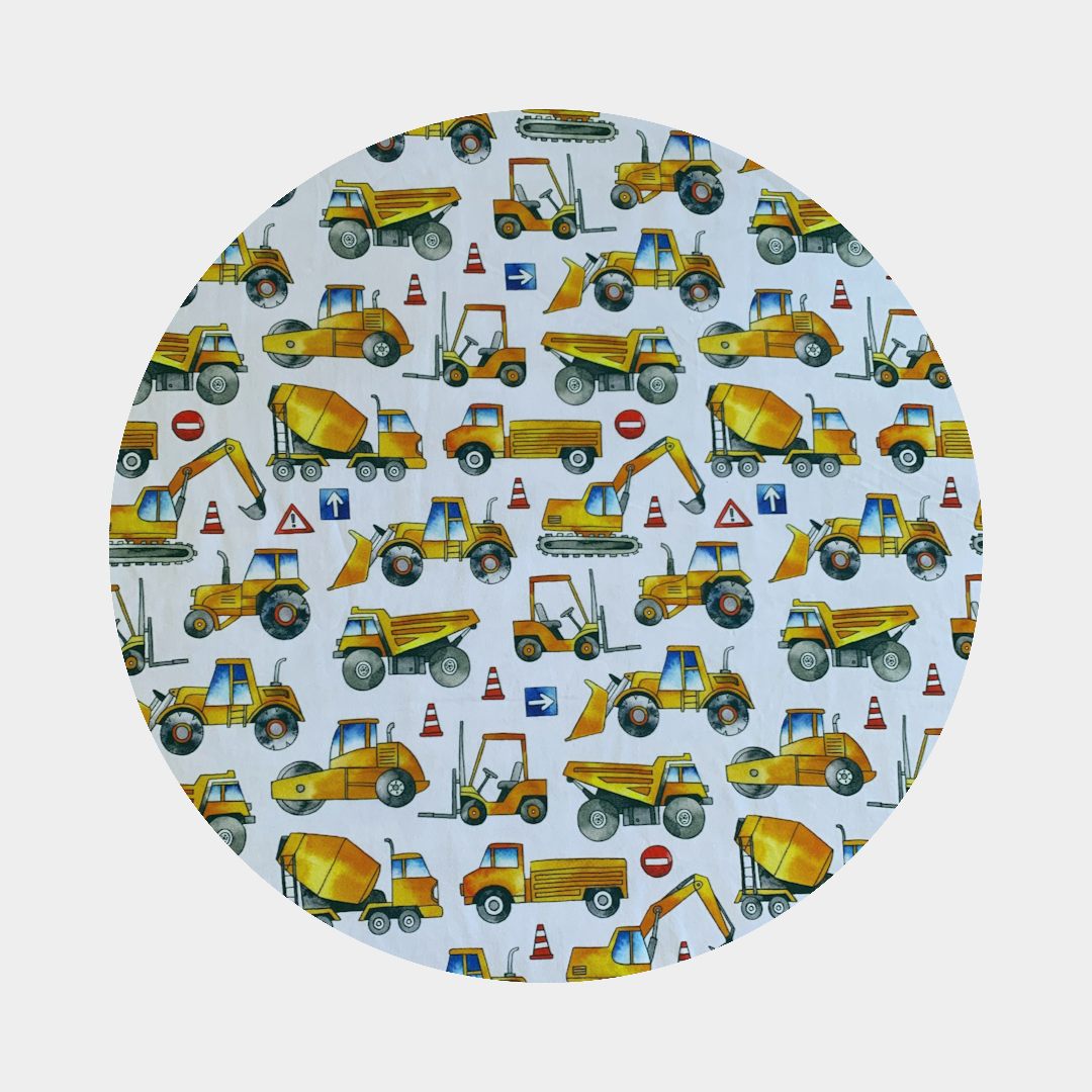 Pattern of orange and yellow construction vehicles on white background